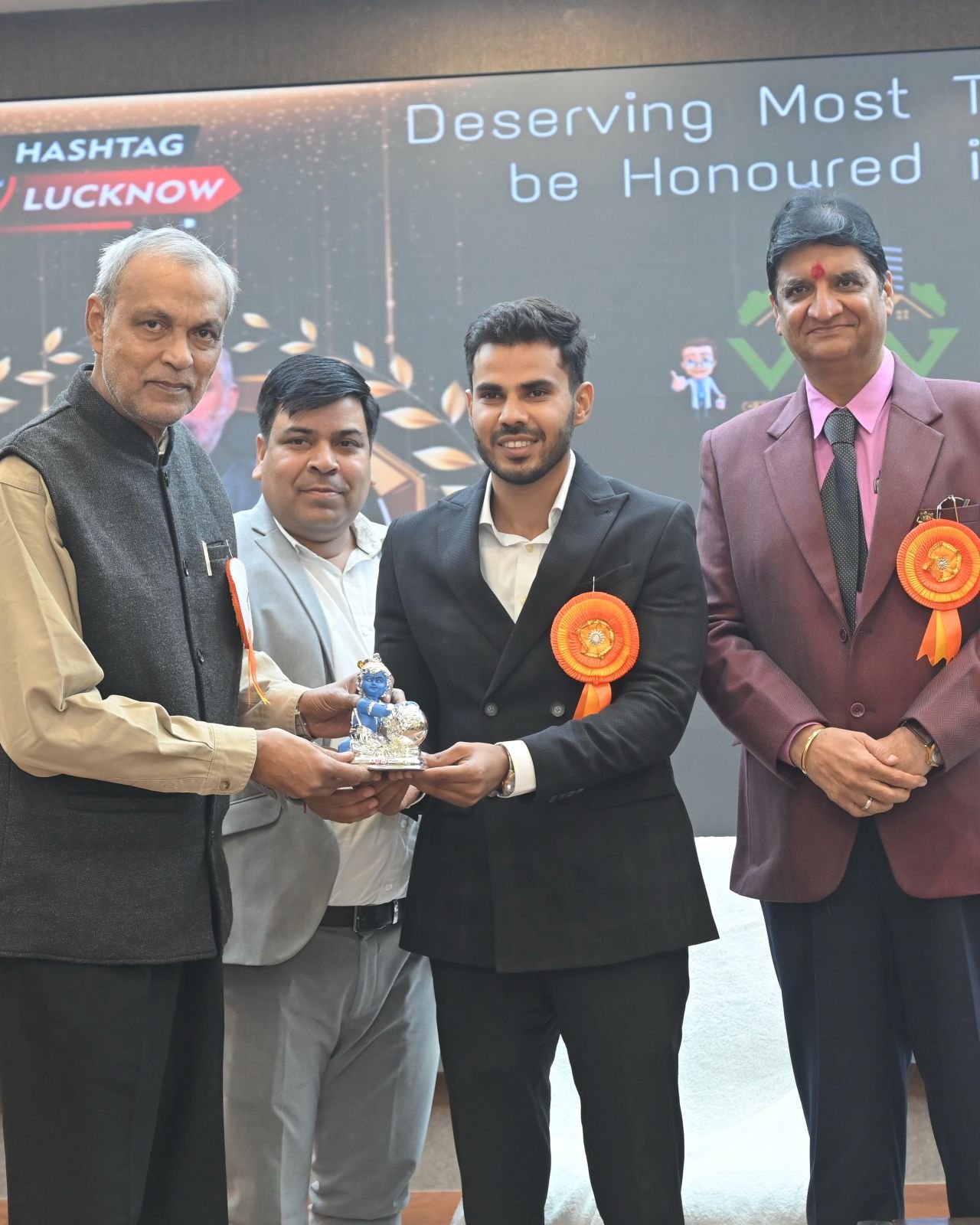 Piyush Singh Chauhan addressing an audience on stage